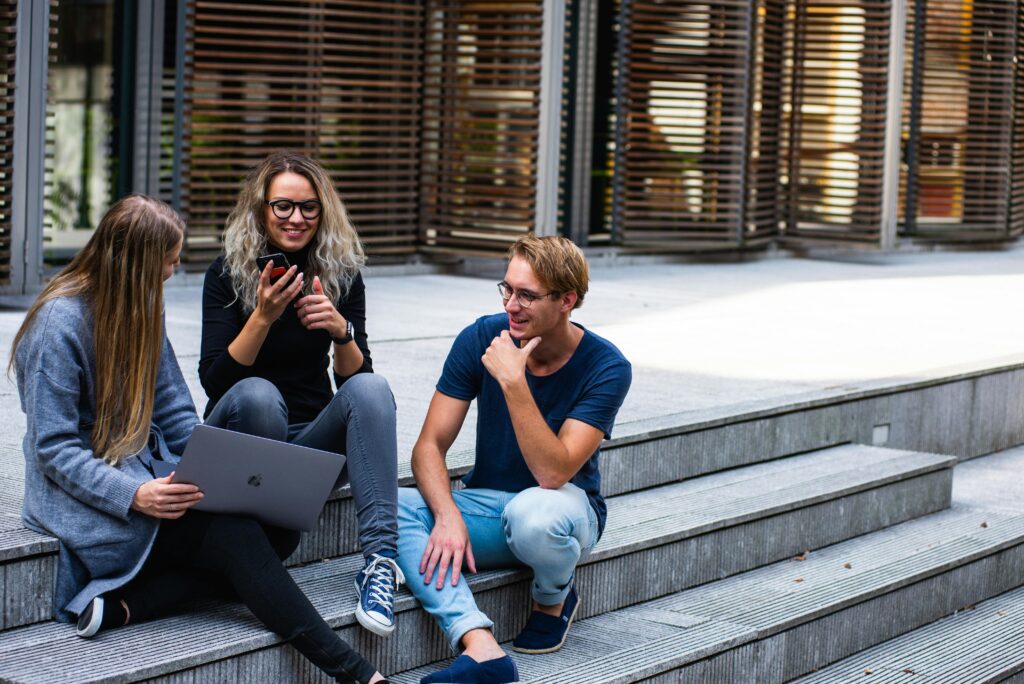 ielts students sitting on stairs 